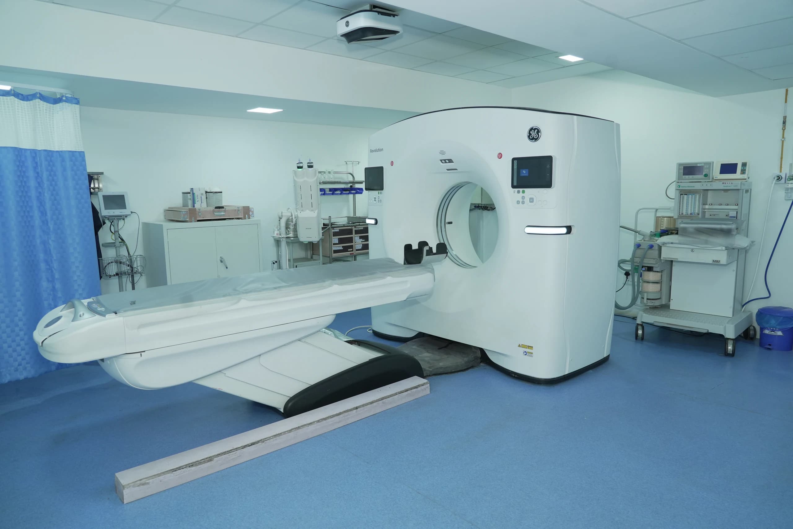Computed tomography scanner and supporting equipment in a hospital imaging suite